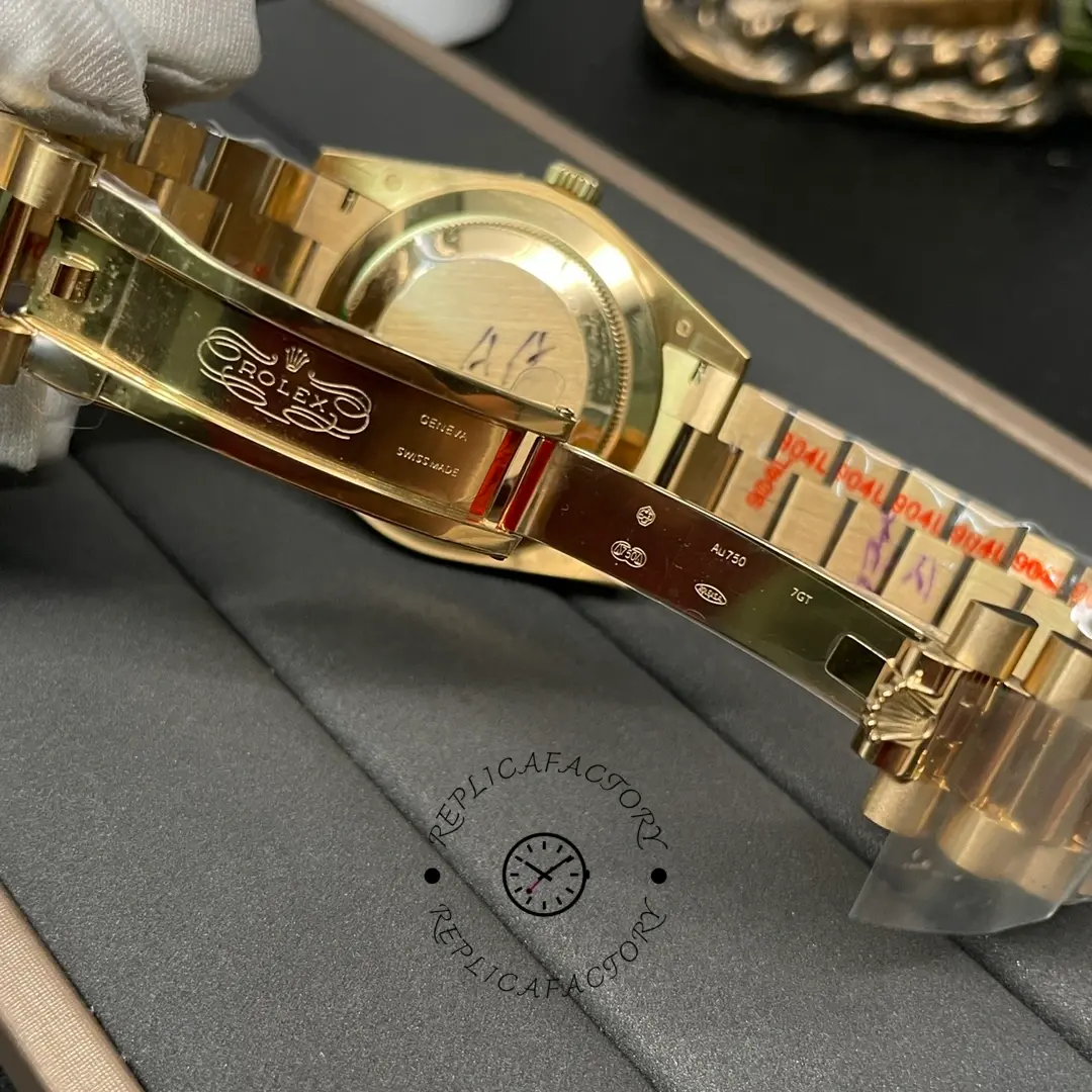 Inner clasp view of Rolex Day-Date 228238 showing engraved clasp interior and folding mechanism.