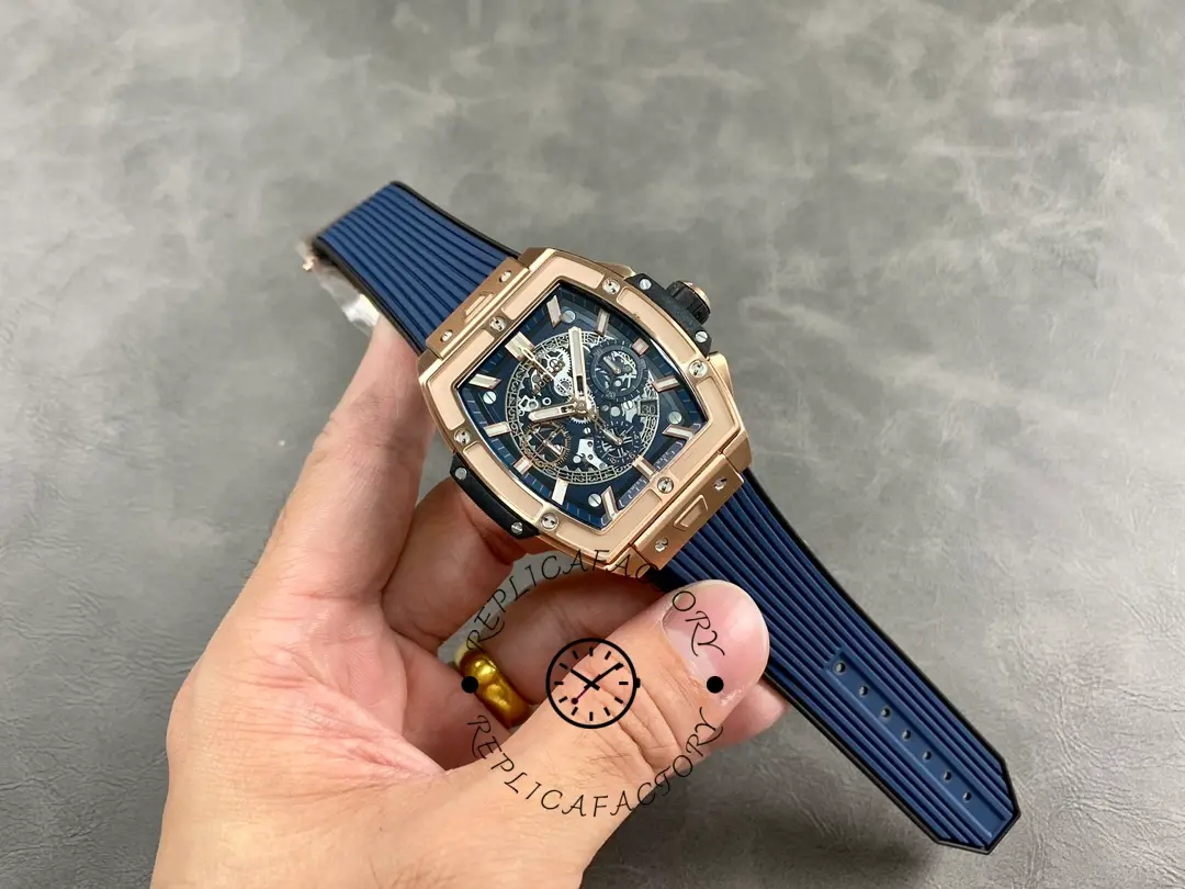 Full watch in hand: Hublot Spirit of Big Bang 642.OX.7180.RX showing blue strap and case shape.