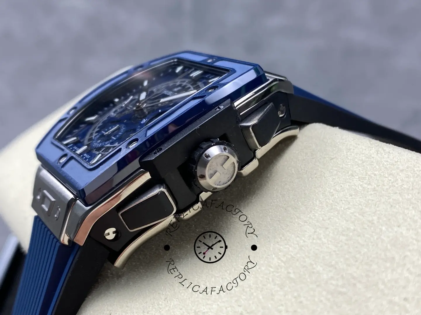 Crown-side angle of Hublot 642.NL.7170.RX showing bezel edge, pushers, and crown guard.