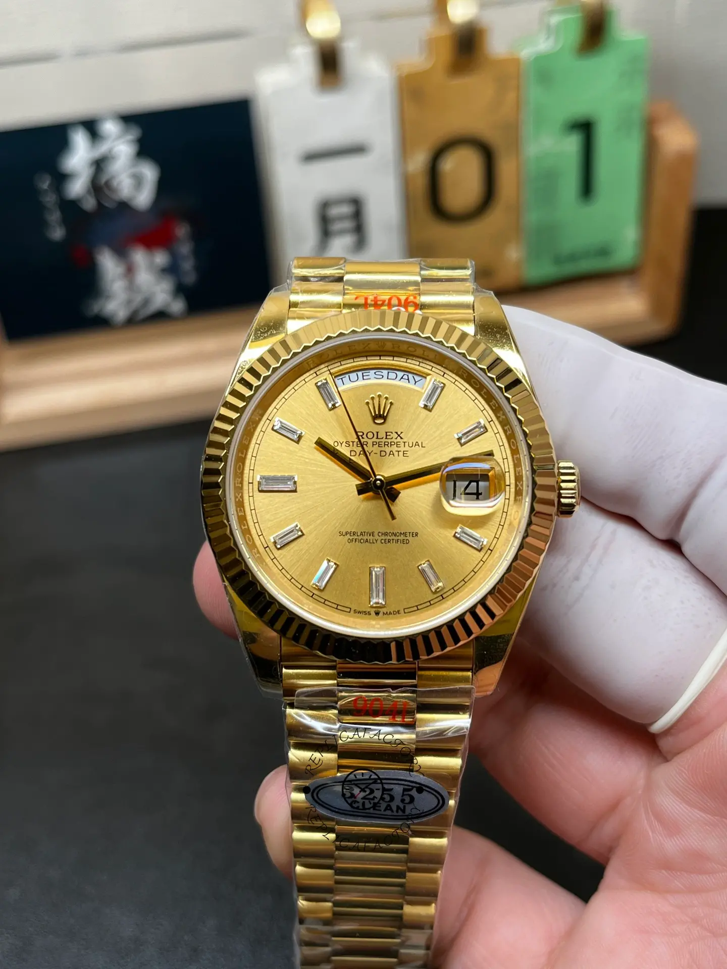 Front view of Rolex Day-Date 40 m228238-0005 with champagne dial, baguette markers, fluted bezel and date magnifier.