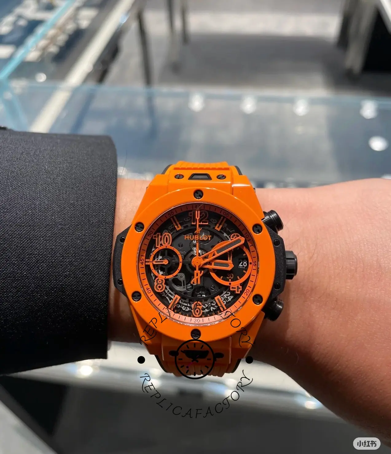 Wrist shot of Hublot Big Bang Unico 441.CU.5910.RX, orange ceramic case stands out.