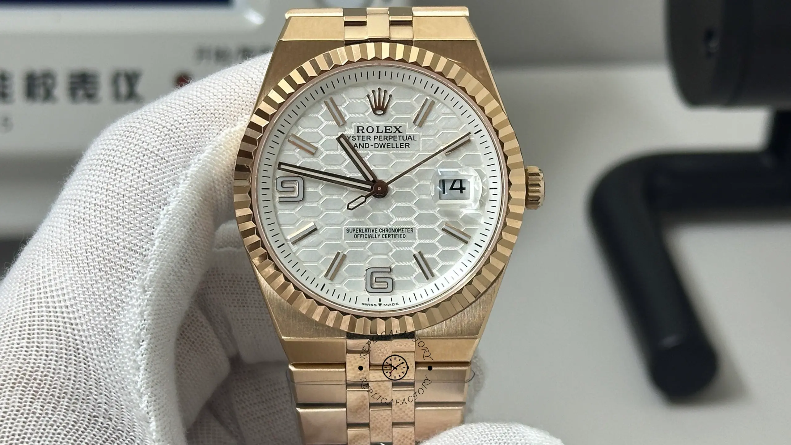 Straight front view of Rolex Land-Dweller M127235-0001 with silver honeycomb dial and rose gold tone case.
