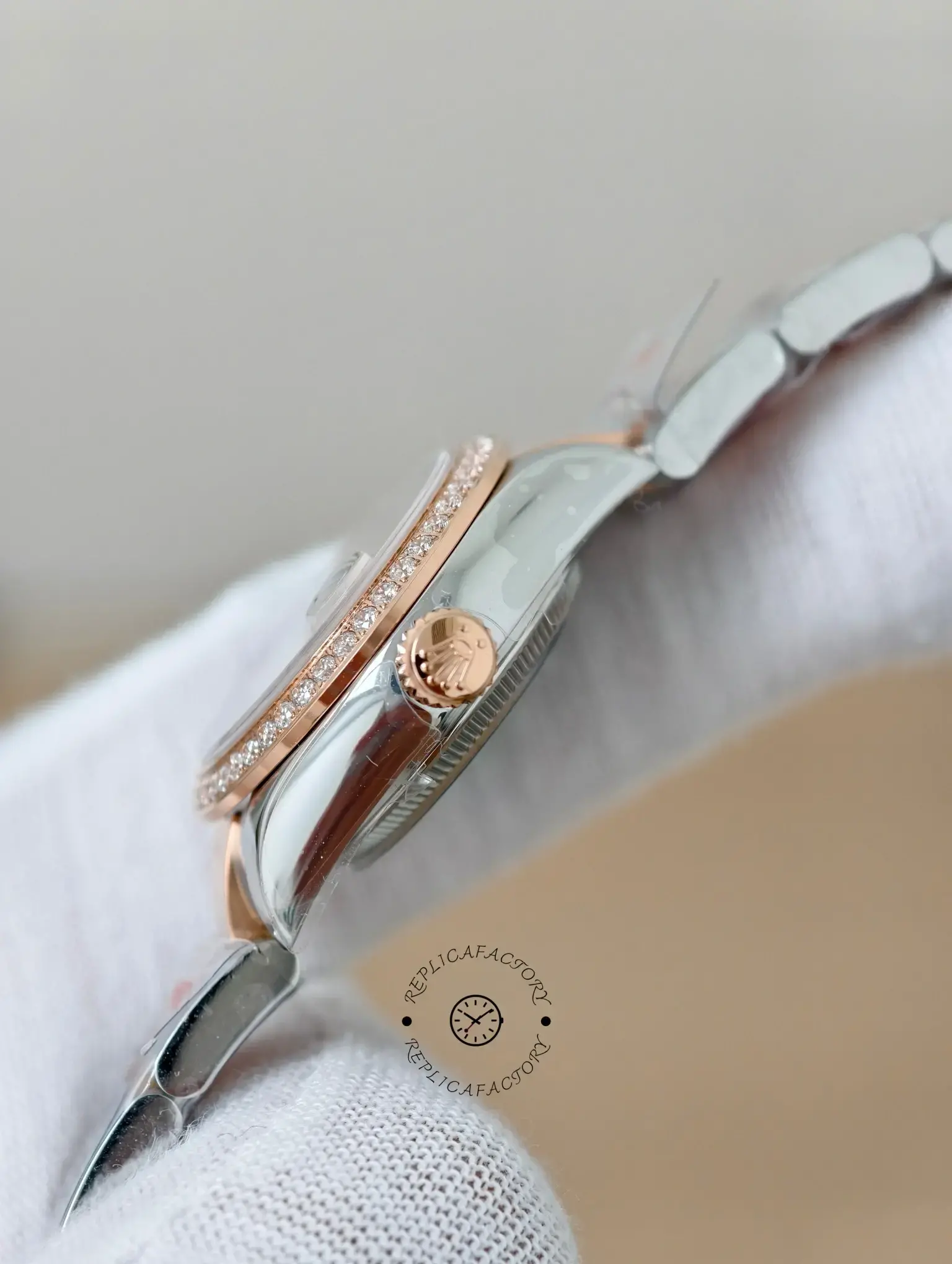 Side view of Rolex Lady-Datejust 279381RBR-0028 showing rose gold crown, polished case, and diamond-set bezel.
