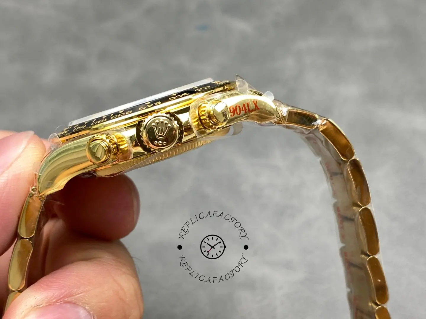 Crown and pusher side view of Rolex 126528LN Le Mans Daytona showing screw-down chronograph controls.