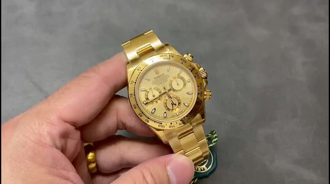 Rolex Daytona 116508 video, handheld view of champagne dial and gold bezel. - Video