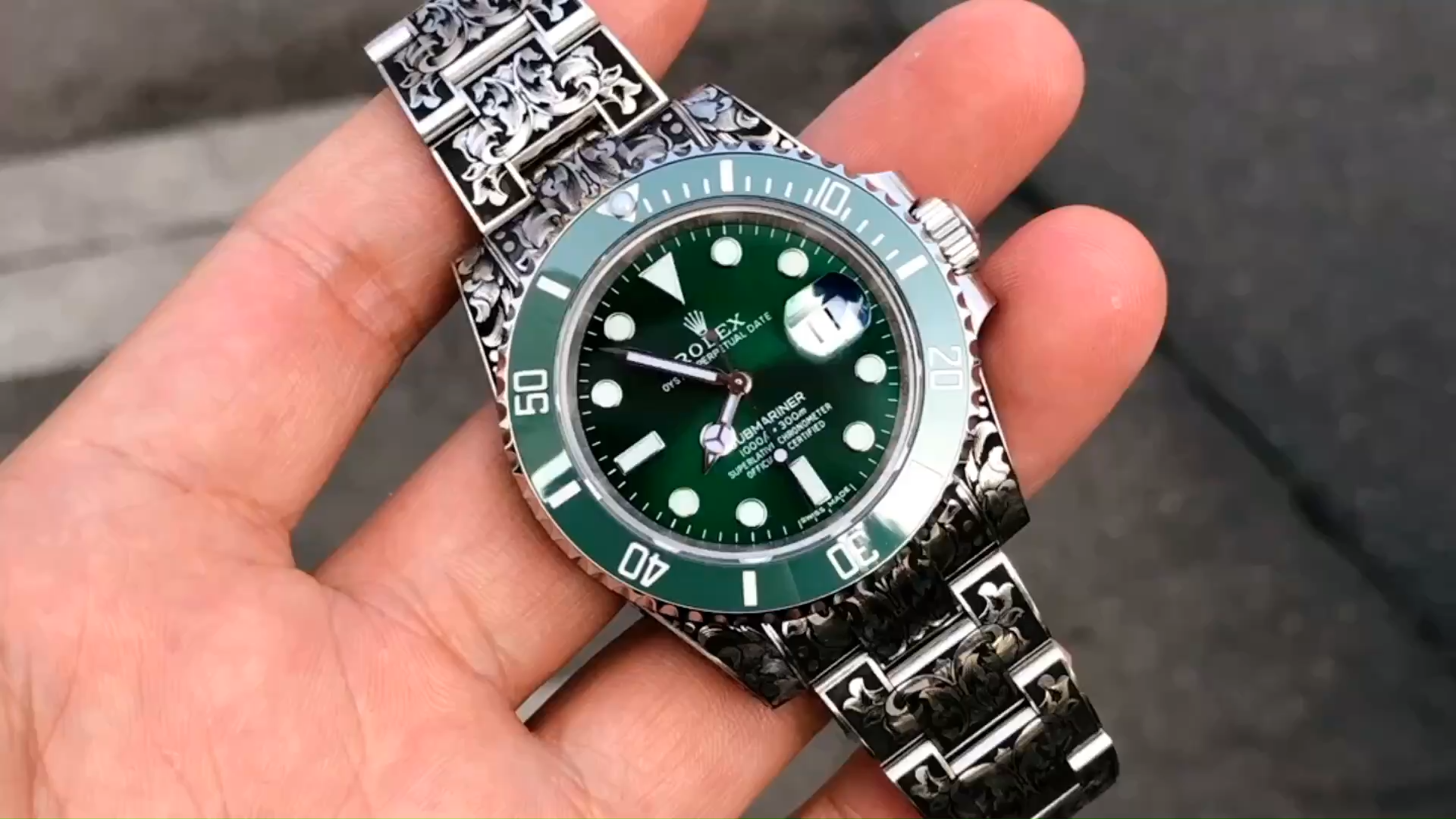 Rolex Submariner Huckleberry Custom Green, held in hand, front view. - Video