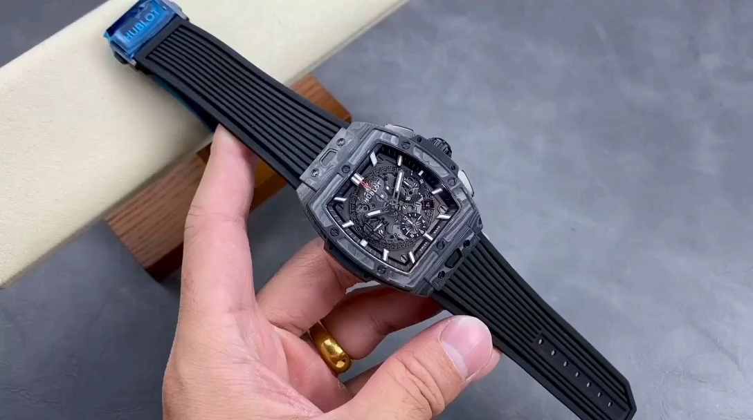 Hand-held strap shot of Hublot 642.CI.0170.RX focusing on rubber strap texture and fit on wrist. - Video