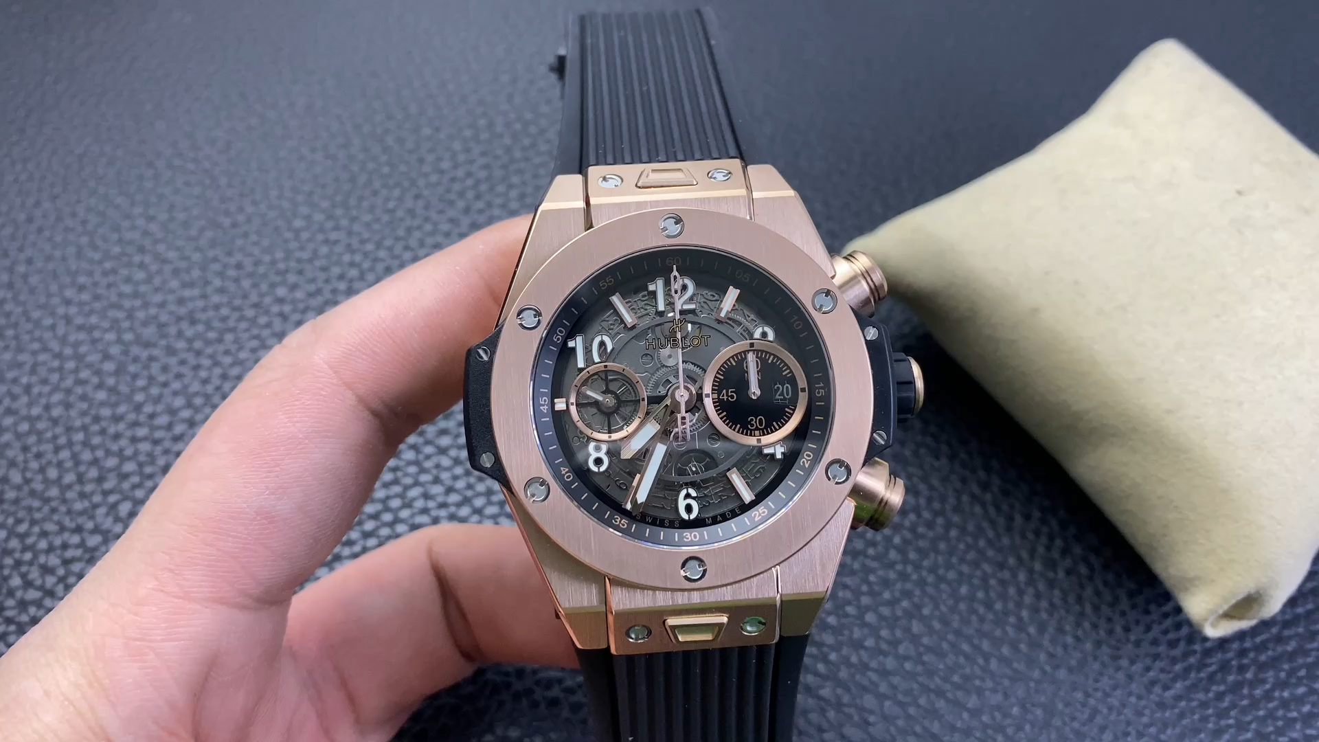 Hand-held shot of Hublot Big Bang UNICO 441.OX.1181.RX, showing case size and strap fit. - Video