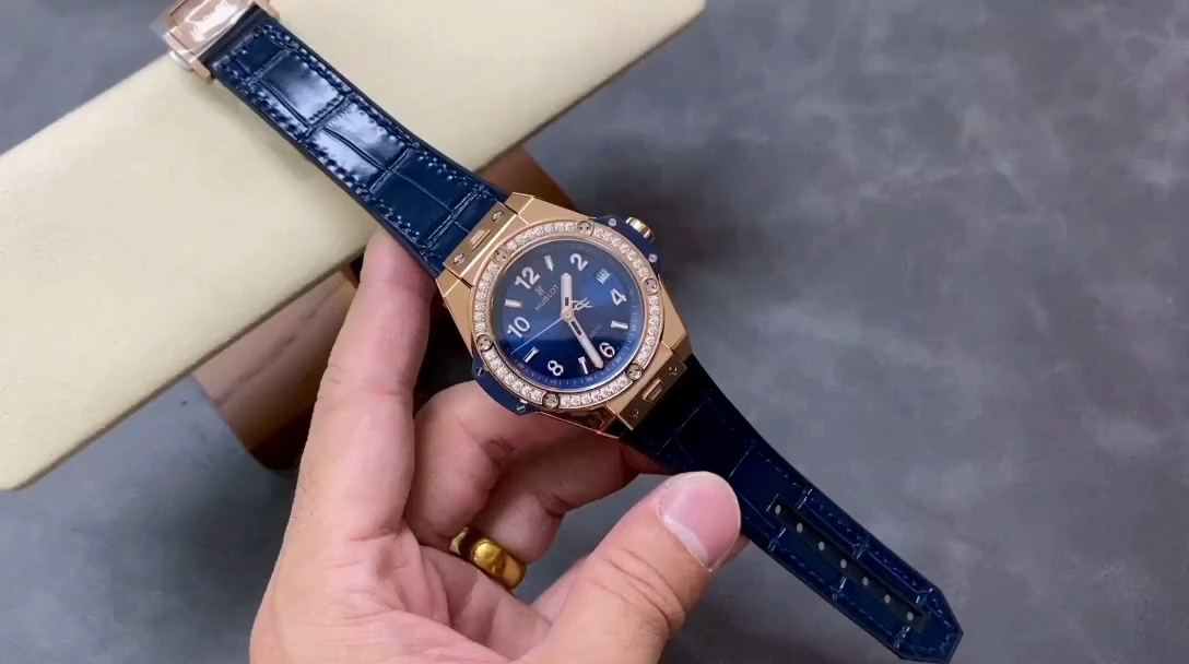 Wrist shot of Hublot Big Bang 465.OX.7180.LR.1204 showing blue strap and diamond-set bezel. - Video