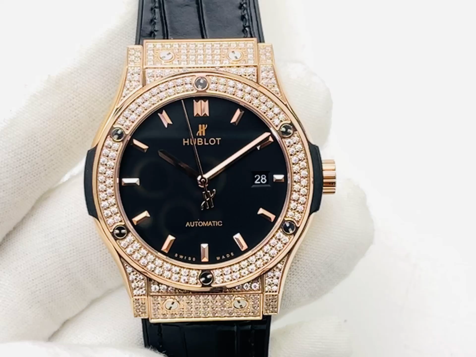 Hublot Classic Fusion 542.OX.1181.LR.1704 hand-held front view, black dial and diamond-set bezel detail. - Video