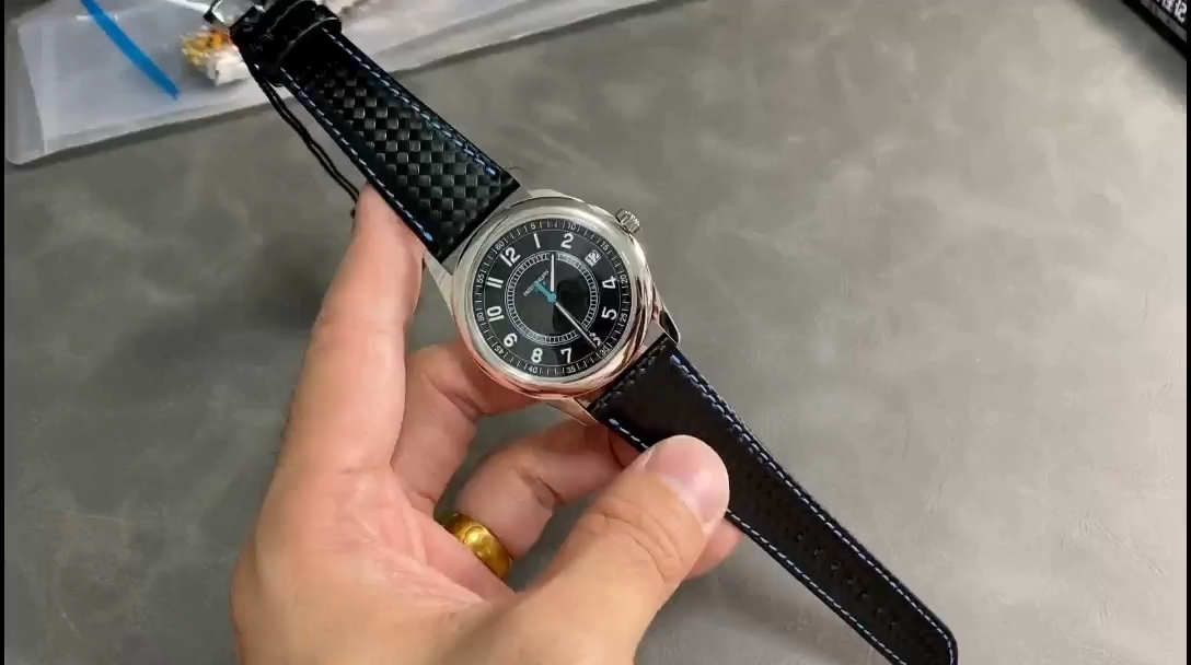 Video of the Patek Philippe Calatrava 6007G-011, showing the watch held in hand. - Video