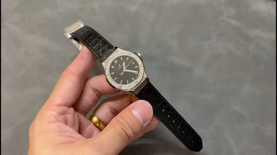 Hublot Classic Fusion 581.NX.1171.LR.1104 hand-held strap view, black leather strap and lug fit detail. - Video