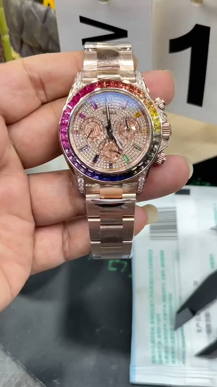 Rolex Daytona 116595RBOW video, handheld view of pavé dial and rainbow sapphire bezel. - Video