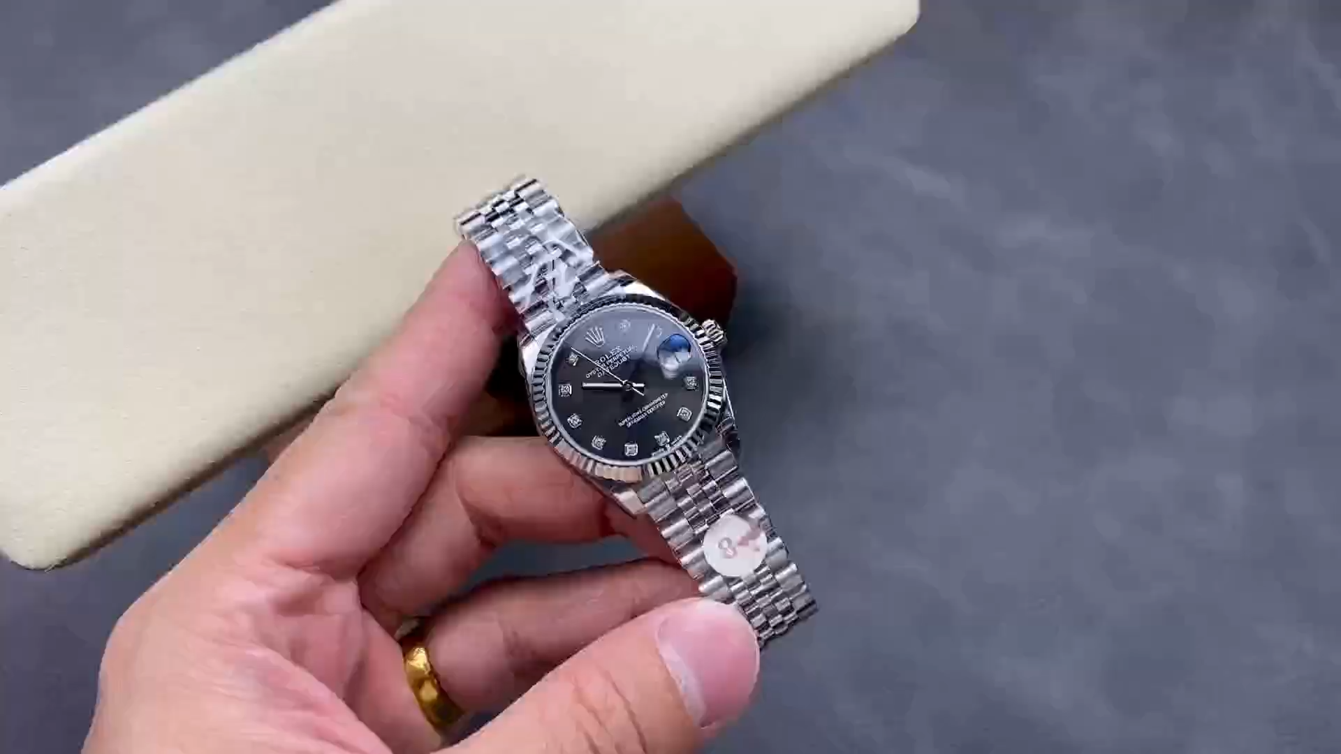 Video of Rolex Datejust 31 278274-0008 showing the watch held in hand from the front. - Video