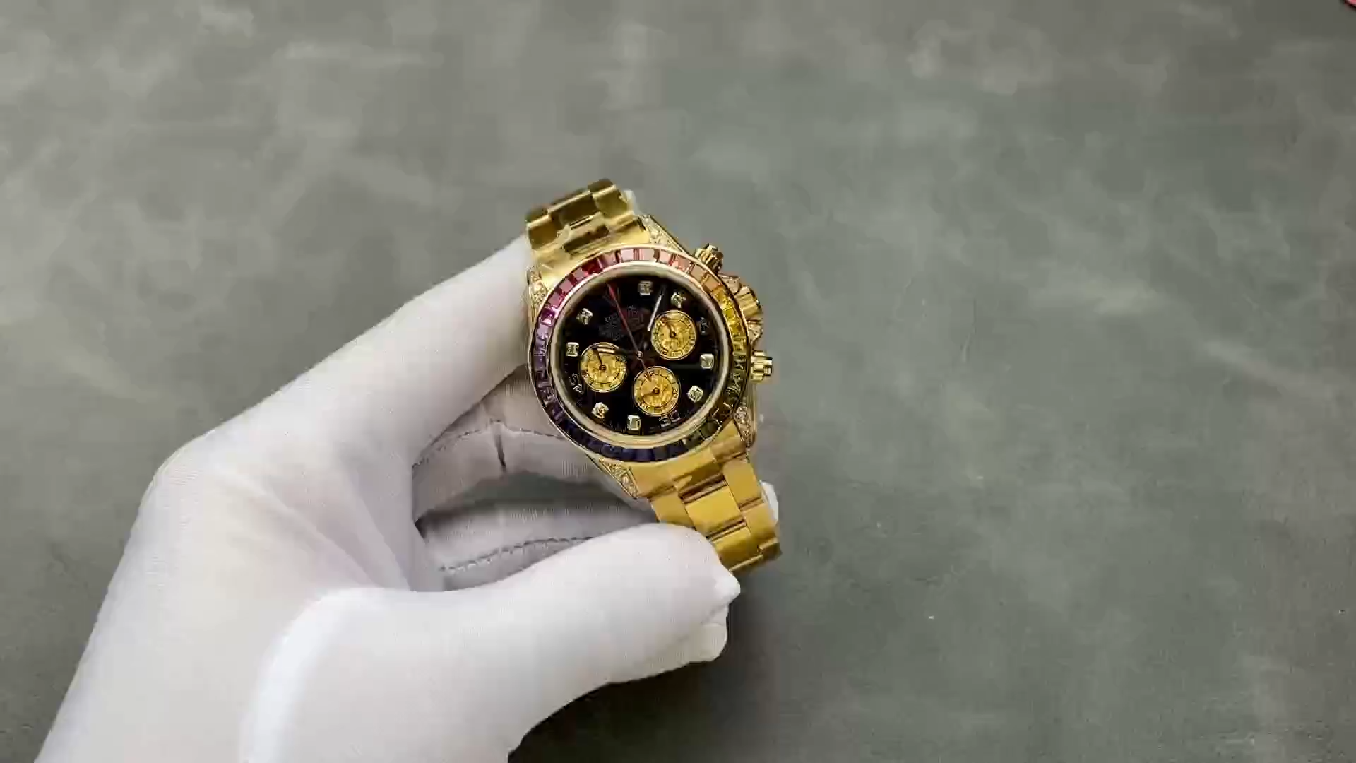 Wrist shot of Rolex Daytona 116598RBOW showing rainbow bezel and yellow gold case. - Video