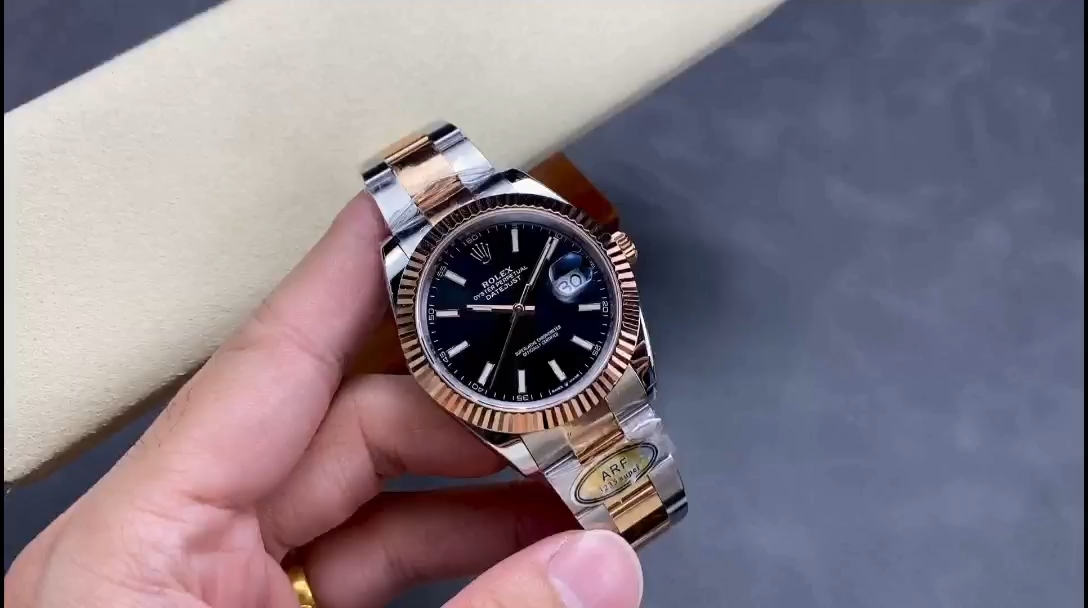 Hand-held view of Rolex Datejust 41 126331 showing black dial and Everose gold steel Oyster bracelet. - Video