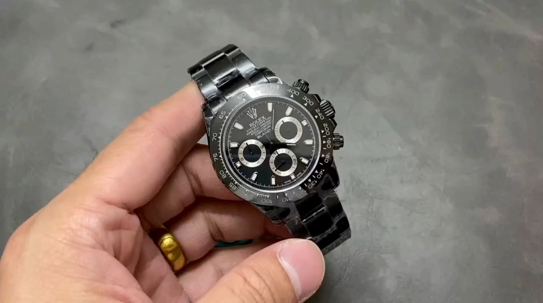 Rolex Daytona 126506, hand-held view showing the full watch face and black rubber strap. - Video