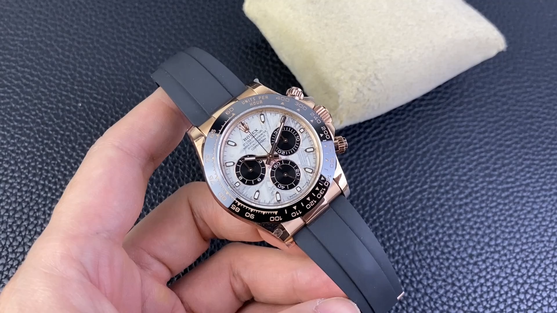 Rolex Daytona 116515LN 0055, video showing the watch held in hand with meteorite dial and black bezel. - Video