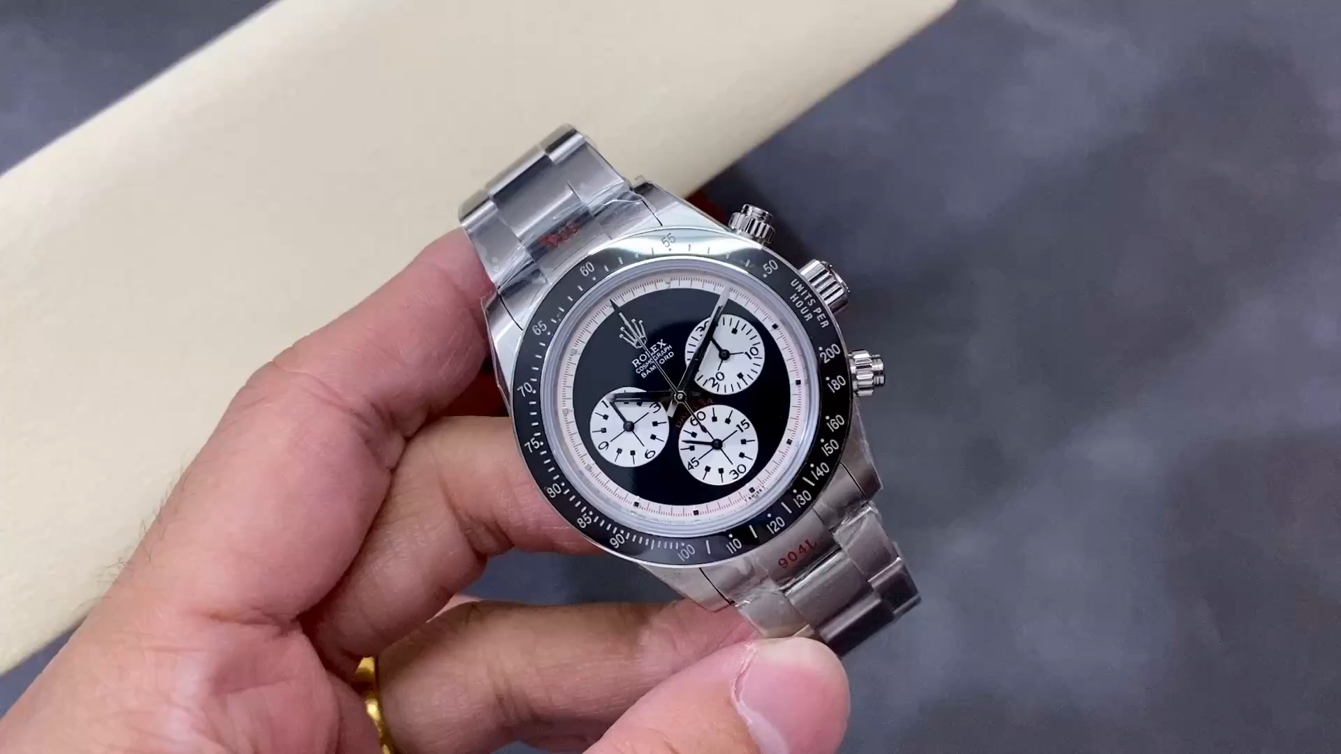 Hand-held shot of Rolex Daytona 116520 on stainless steel bracelet, video preview. - Video