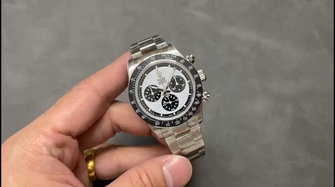 Hand-held view of Rolex Daytona 6263, showing the white dial and black subdials on wrist. - Video