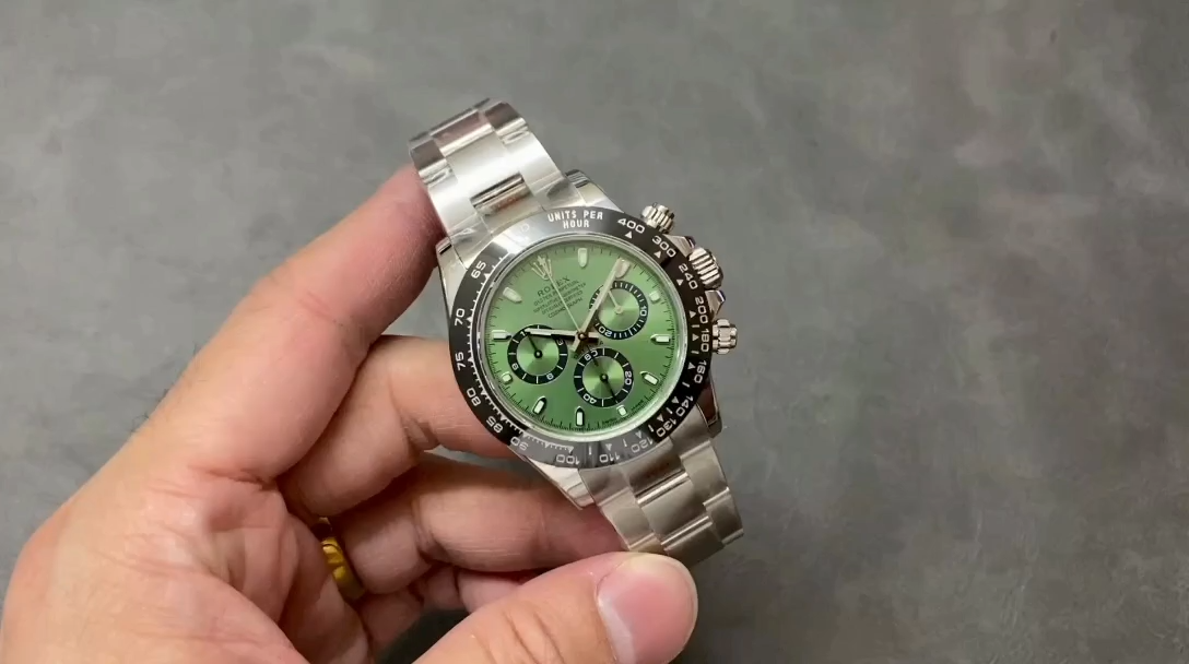 Hand-held shot of Rolex Daytona 126506, showing the green dial and tachymeter bezel. - Video