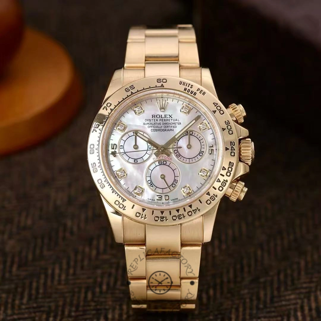 Rolex Daytona 116508 0007 on table, mother-of-pearl dial, yellow gold bracelet.