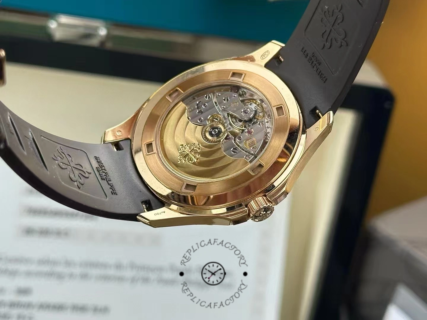 Exhibition caseback of Patek Philippe Aquanaut 5167R-001 showing gold rotor and movement finishing.