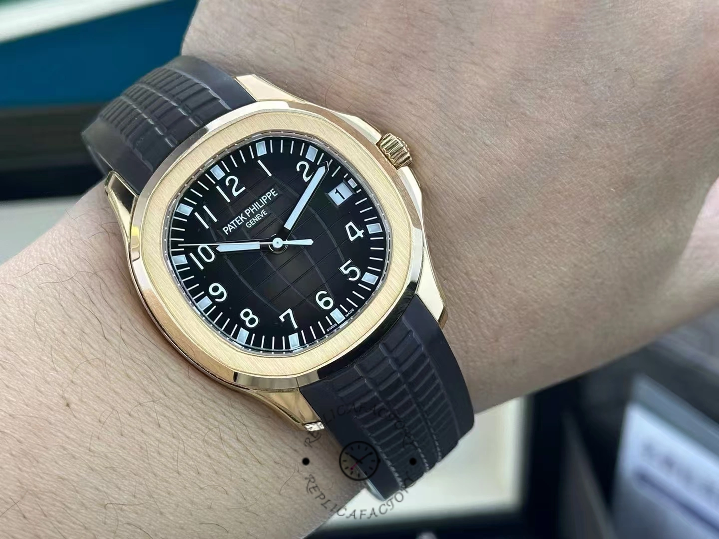 Wrist shot of Patek Philippe Aquanaut 5167R-001 showing fit on wrist and rose-gold case.