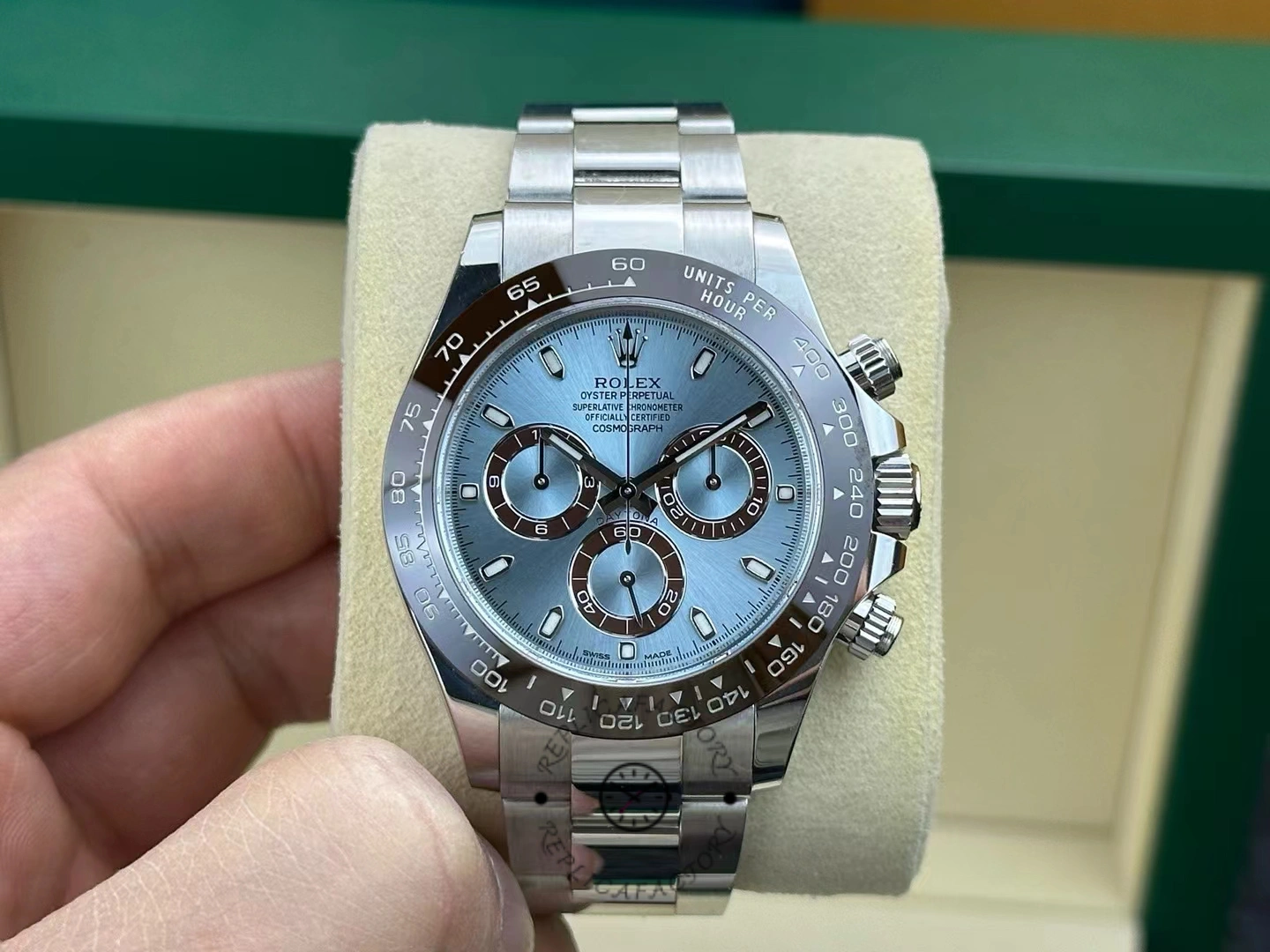 Front view of the Rolex Cosmograph Daytona 116506 with ice-blue dial and brown ceramic bezel on cushion.