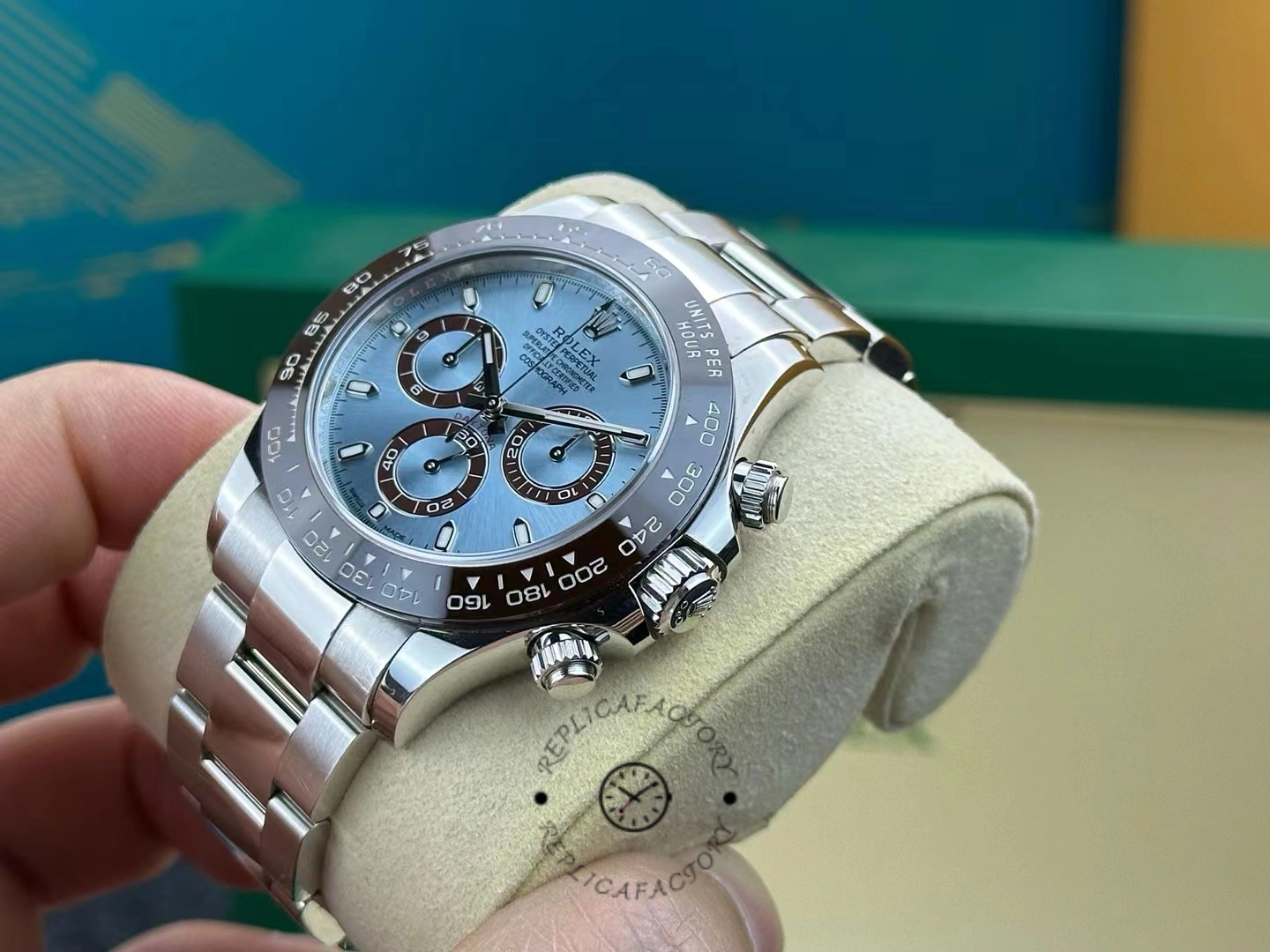 Side angled view of the Rolex Daytona 116506 highlighting the brown bezel and chronograph pushers.