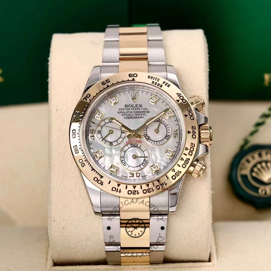 Display shot of Rolex Daytona 116503 on stand showing white MOP dial and two-tone case.