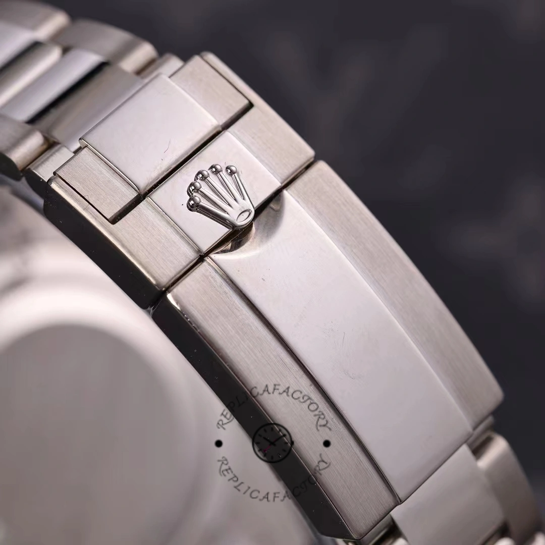 Rolex GMT-Master II 116719BLRO bracelet close-up, Rolex coronet on clasp, on cushion.