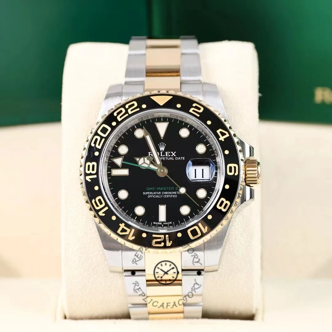 Display view of the Rolex GMT-Master II 116713LN on cushion, black dial and two-tone bracelet.