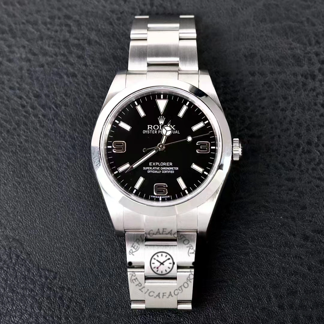 Rolex Explorer 214270, black dial and smooth bezel, Oyster bracelet, front view on black.