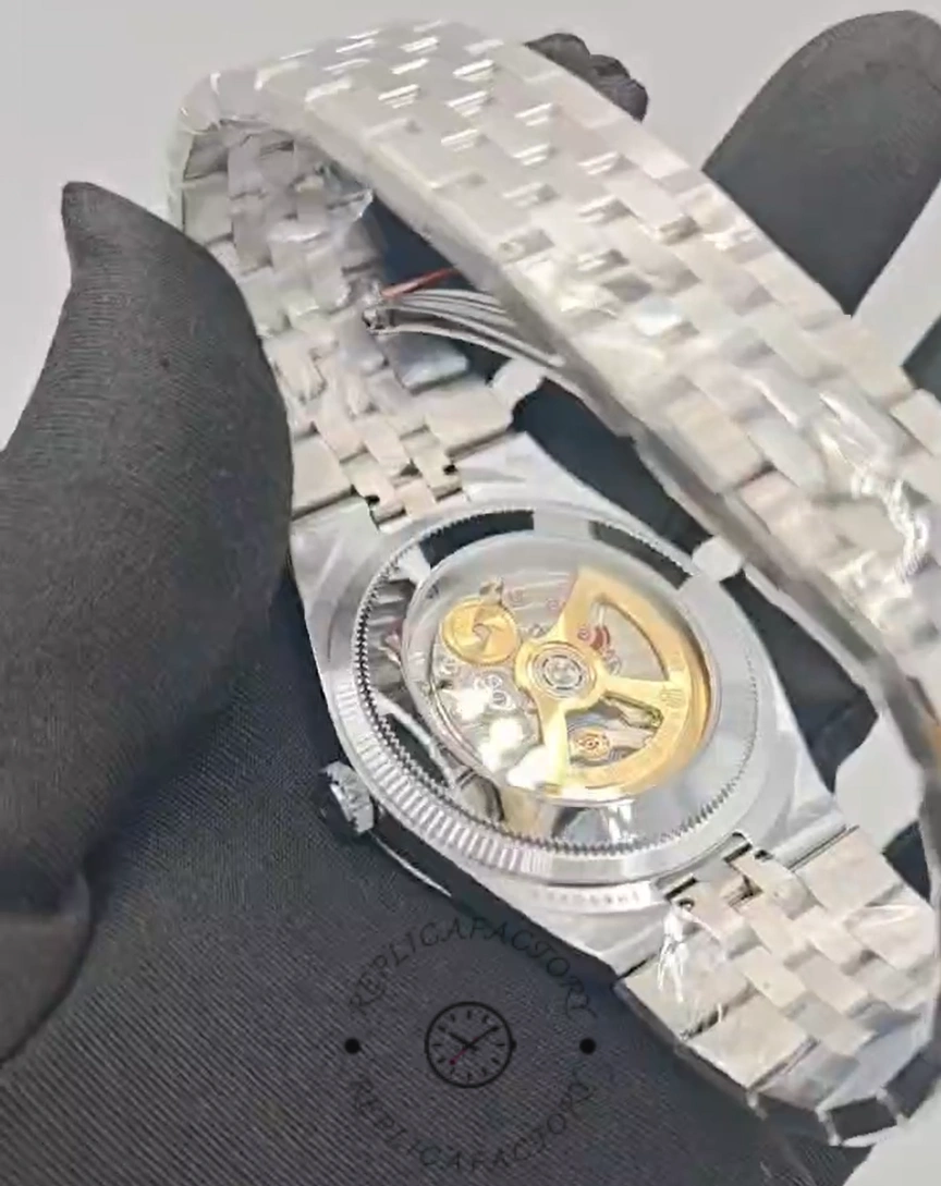 Transparent caseback view of Rolex Land-Dweller 36 M127236-0001 Replica revealing automatic movement.