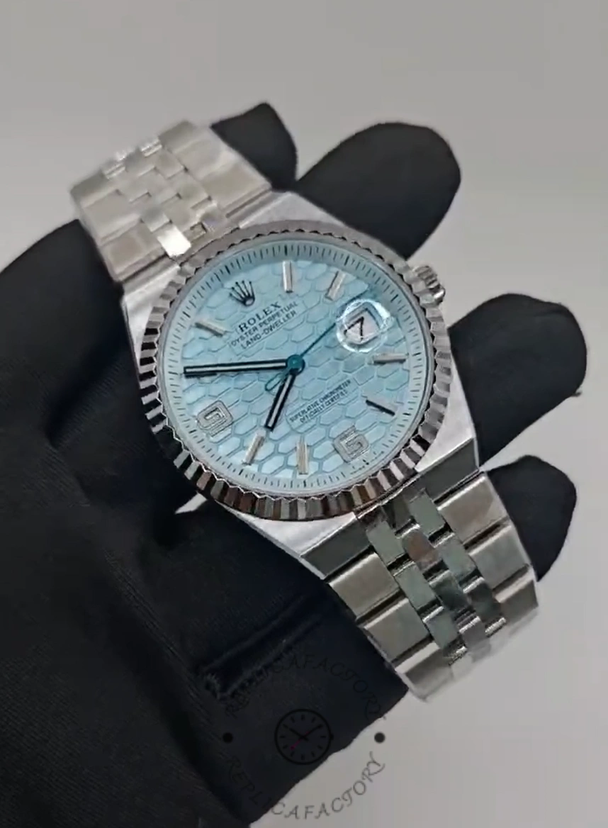 Close-up front view of Rolex Land-Dweller 36 M127236-0001 Replica with ice blue dial and cyclops date.