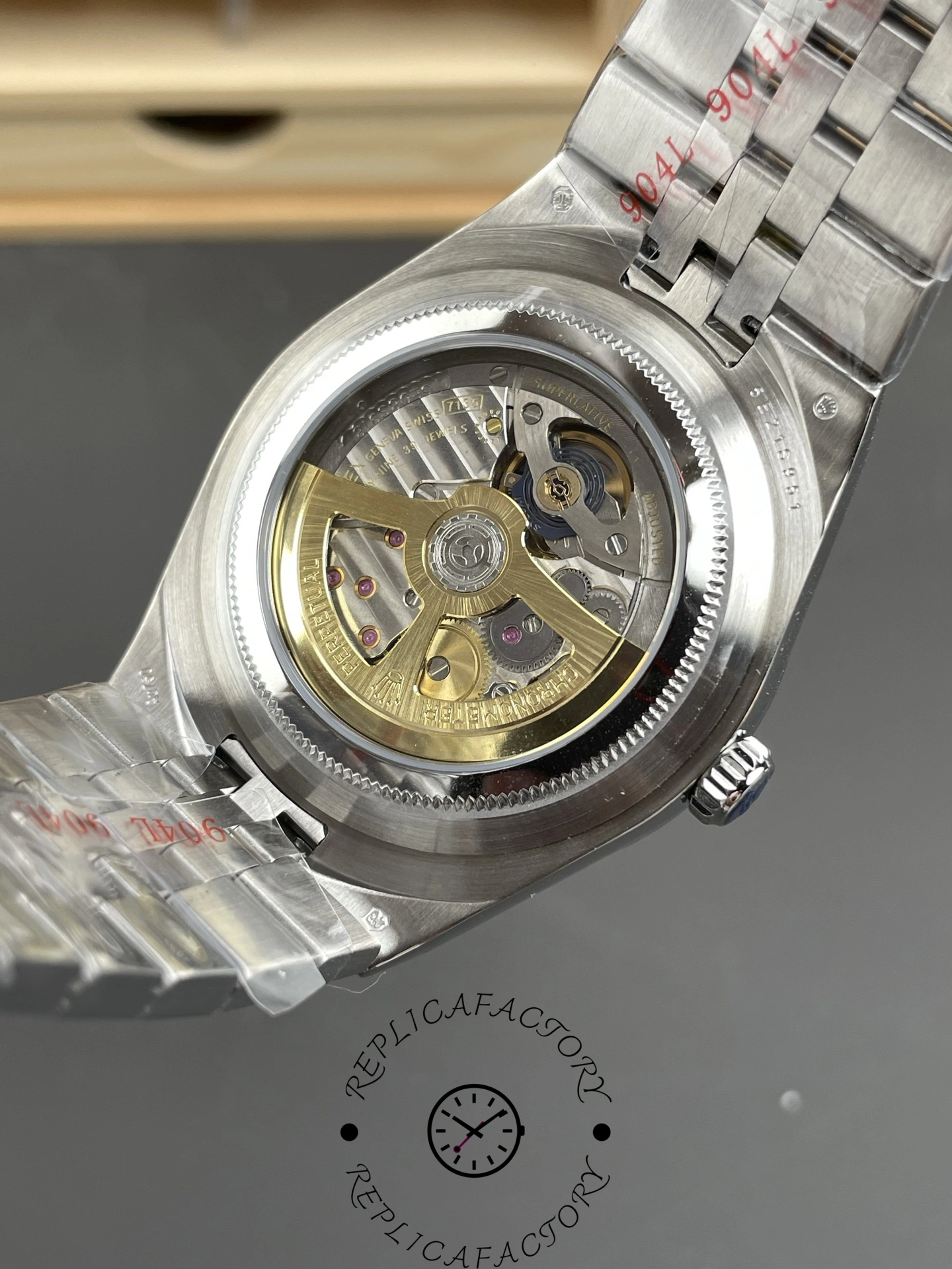 Transparent caseback view of Rolex Land-Dweller 40 127336-0001 Replica revealing automatic movement.