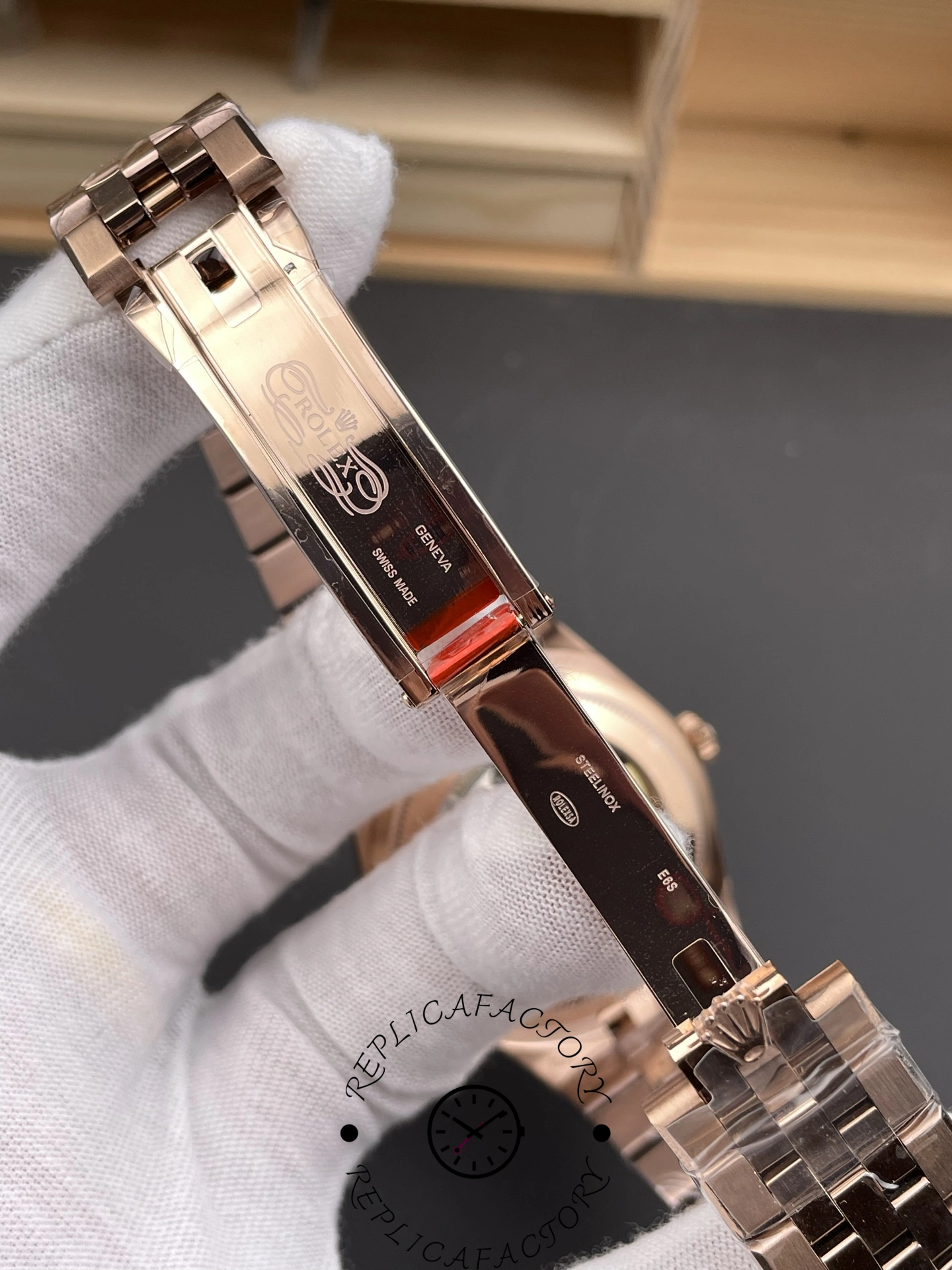 Close-up of folding clasp on Rolex Land-Dweller M127235-0001 Replica showing rose gold buckle detail.