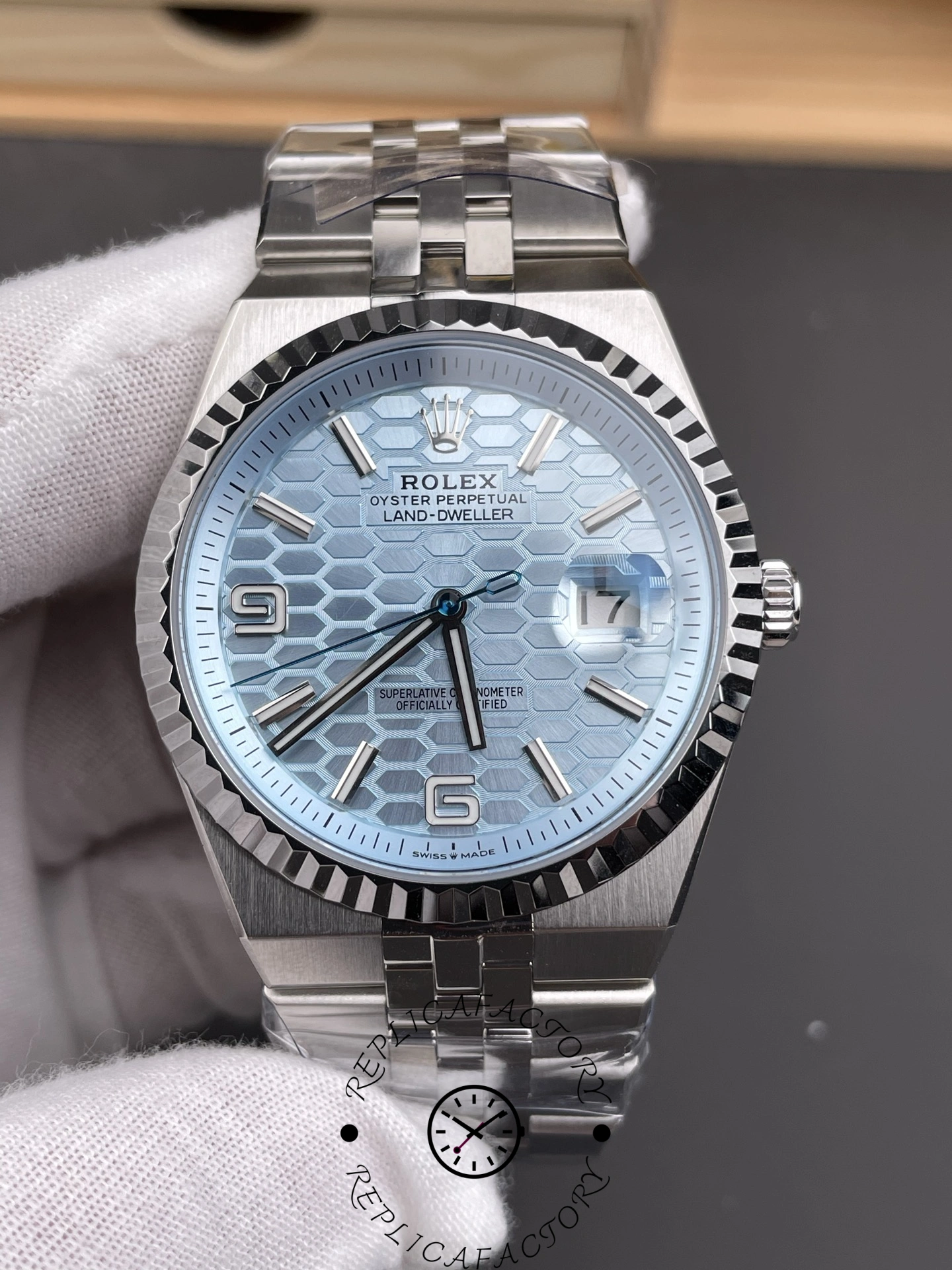 Close-up front shot of Rolex Land-Dweller 40 127336-0001 Replica showing ice blue dial and cyclops date.