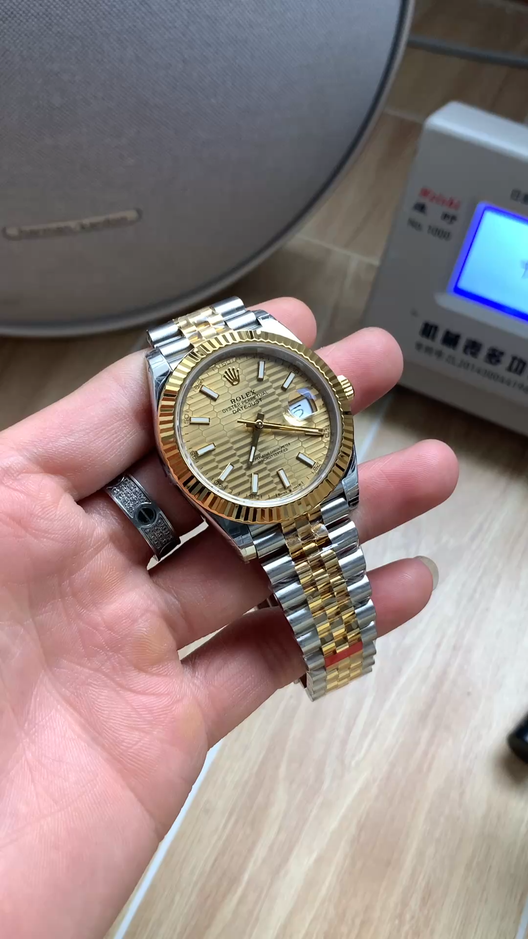 Front view of Rolex Datejust 41 126333 held in hand showing the champagne dial and two-tone Jubilee bracelet. - Video