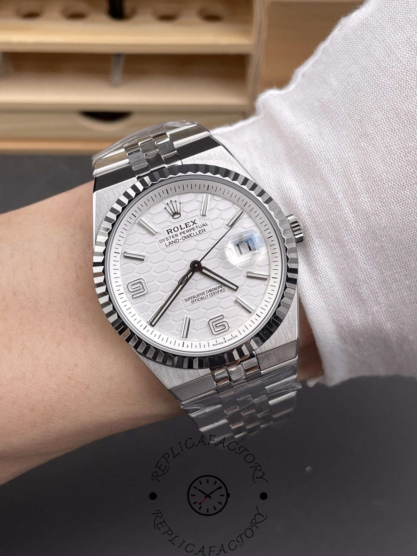 Wrist shot of Rolex Land-Dweller 40 M127334-0001 Replica showing 40mm case fit and Jubilee bracelet on wrist.