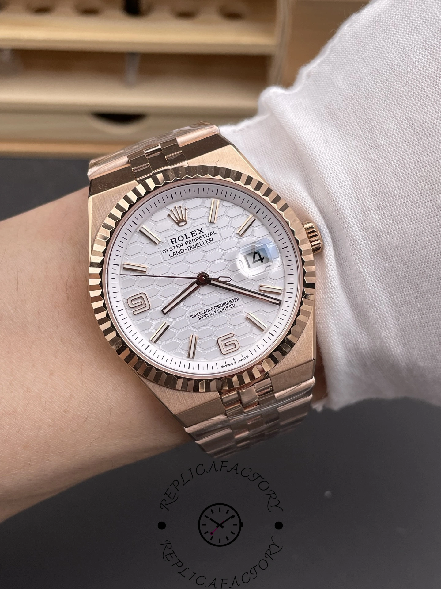 Wrist shot of Rolex Land-Dweller M127235-0001 Replica showing 40mm rose gold case fit on wrist.