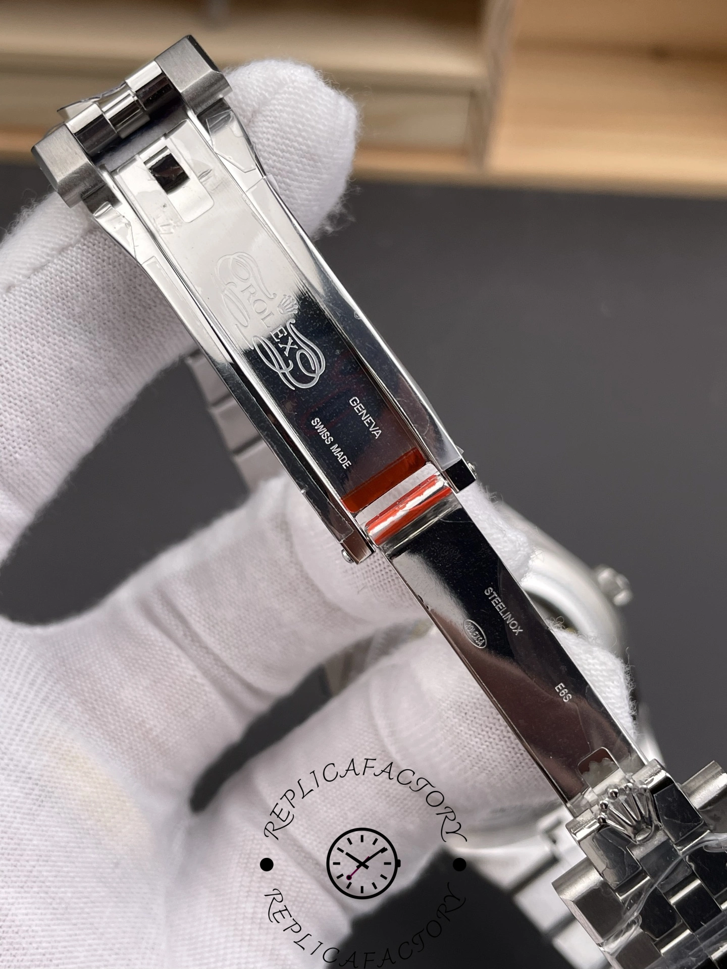 Close-up of clasp on Rolex Land-Dweller 40 M127334-0001 Replica showing polished folding buckle detail.