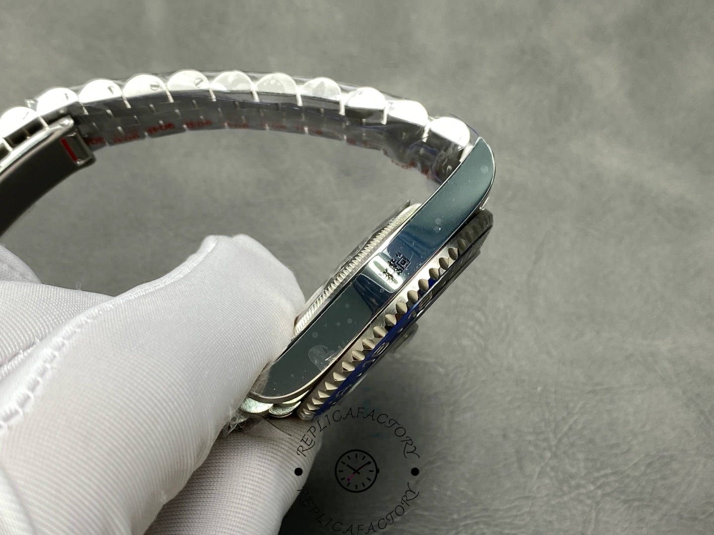 Rolex GMT-Master II 126710BLNR side profile, case thickness and bezel edge, held in glove.