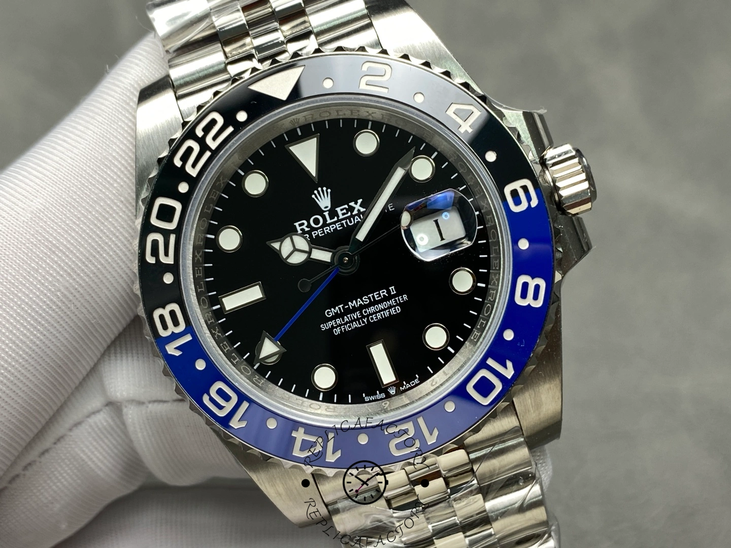 Rolex GMT-Master II 126710BLNR front view in glove, black dial, Batman bezel, Jubilee bracelet.