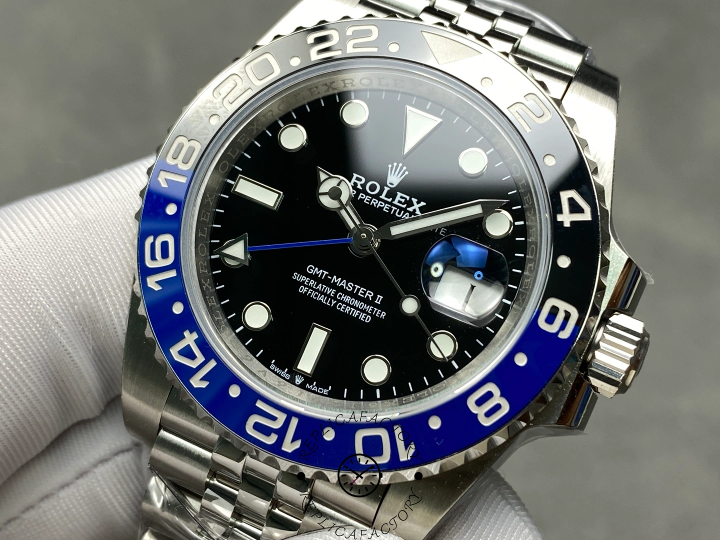 Rolex GMT-Master II 126710BLNR close front view, black dial details, Batman bezel numerals.