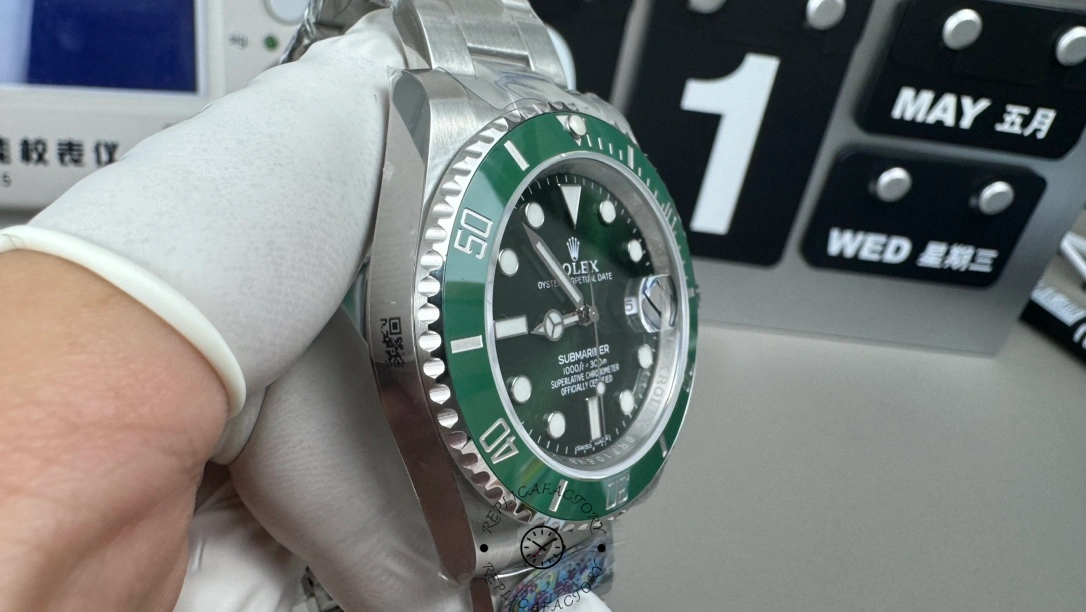 Rolex Submariner 116610LV, side profile on gloved hand, showing case and bezel.