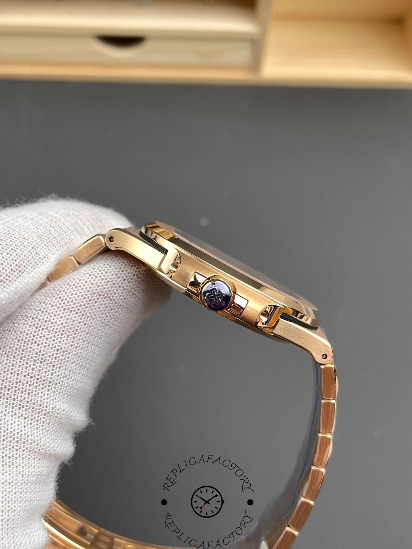 Side profile of Patek Philippe Nautilus 5711/1R-001 showing crown and slim case.