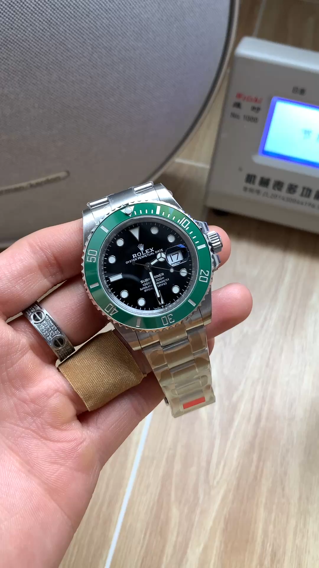 Rolex Submariner 126610LV video, wrist view with green bezel and black dial.