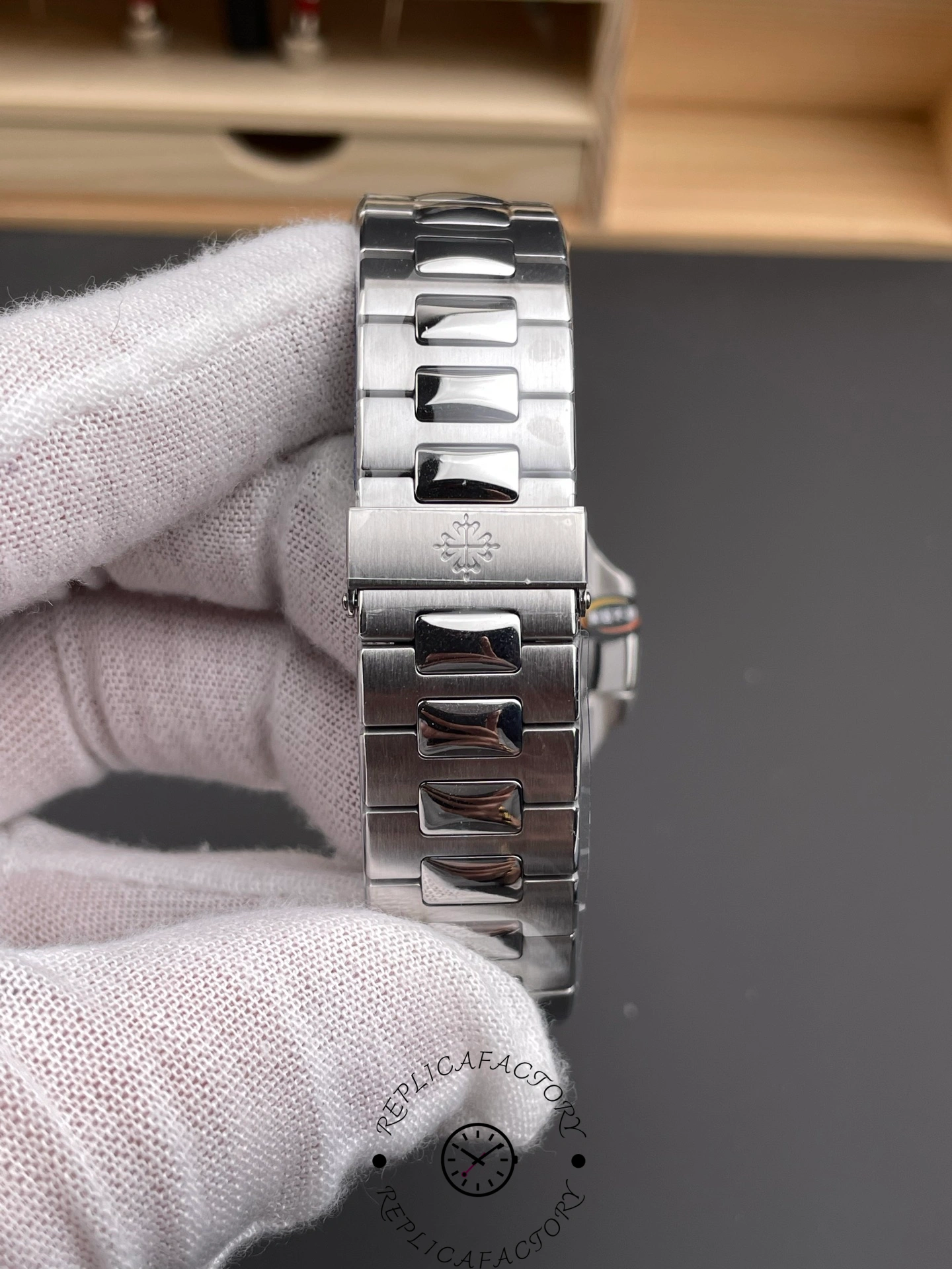 Clasp-side view of Patek Philippe Nautilus 5711/1A showing deployant clasp and bracelet finish.